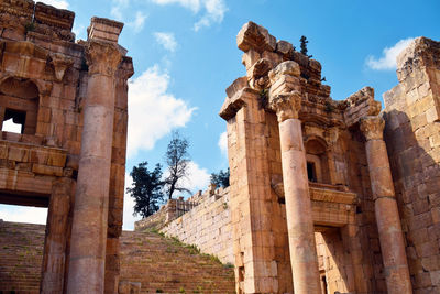 Low angle view of old temple against sky