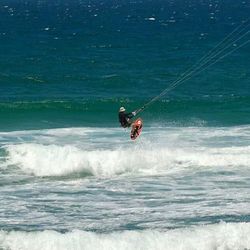 People surfing in sea