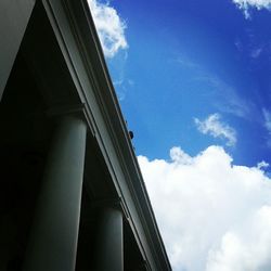 Low angle view of building against cloudy sky