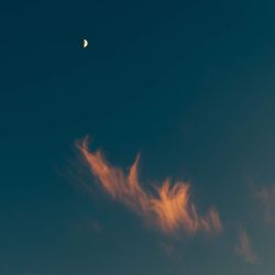 Low angle view of moon against sky at night