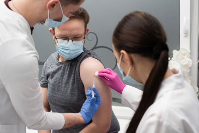 Doctor examining patient in hospital