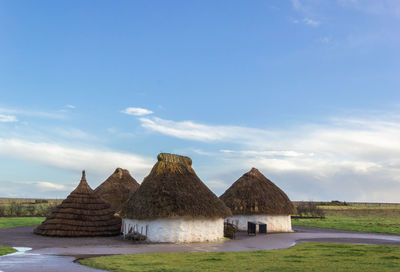 Built structure on land against sky