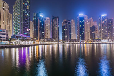 Illuminated buildings in city at night