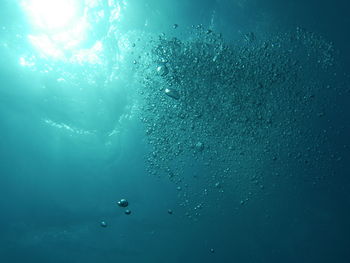 Low angle view of bubbles in sea