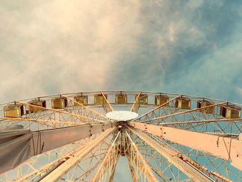 Low angle view of ferris wheel against sky