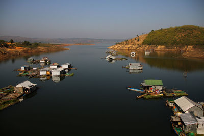 High angle view of boats moored in lake against sky