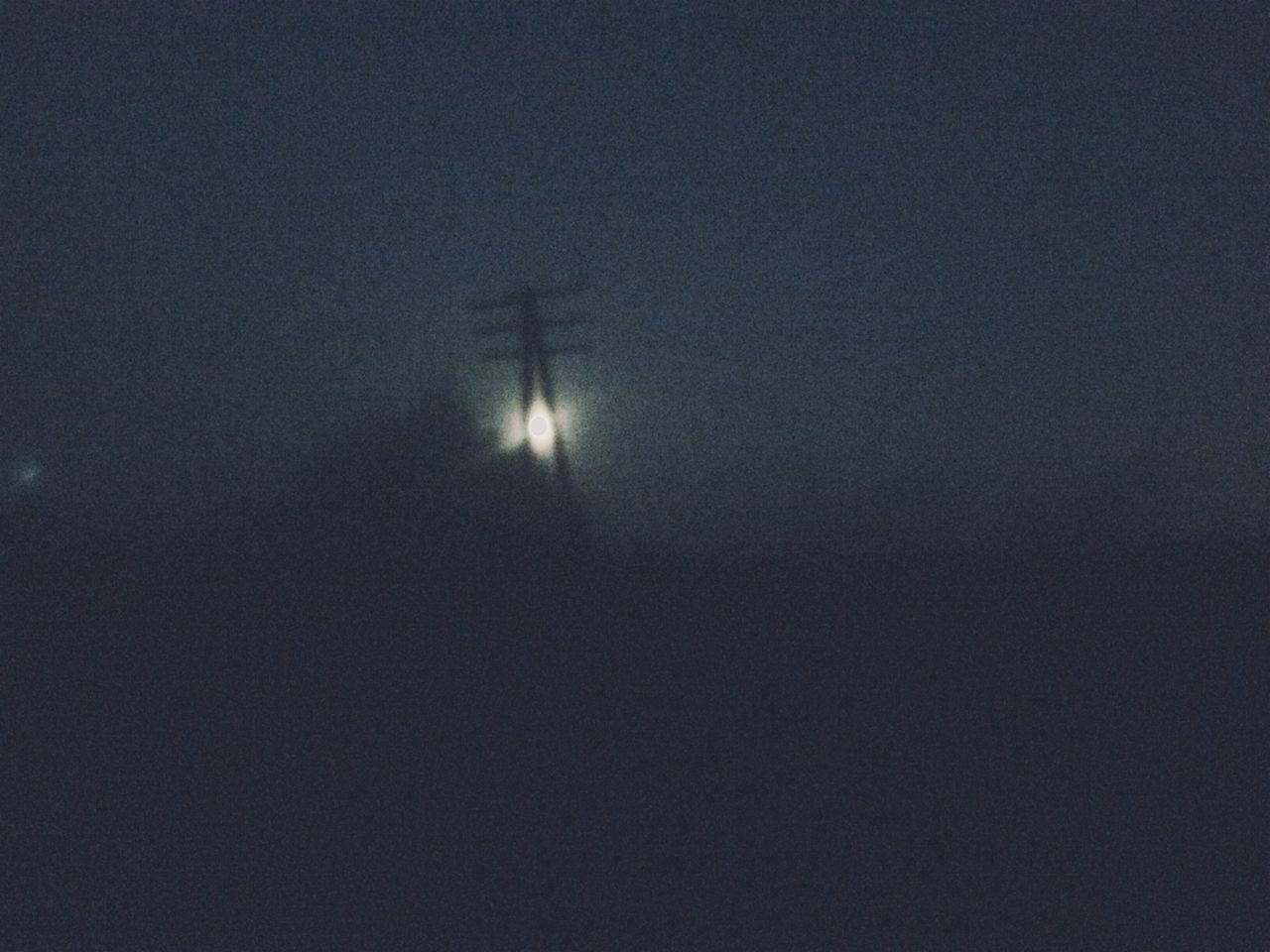 LOW ANGLE VIEW OF SILHOUETTE MOON IN SKY