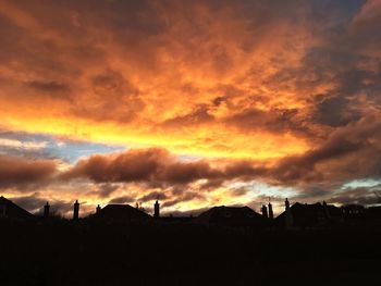 Panoramic view of dramatic sky over silhouette landscape