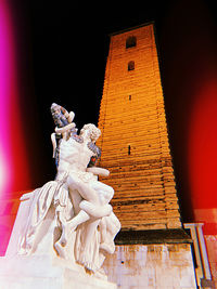 Low angle view of statue against building