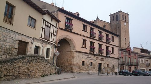 Low angle view of buildings against sky in city