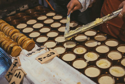 Midsection of person preparing food