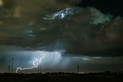 Powerful lightning bolt strikes from a dramatic thundercloud