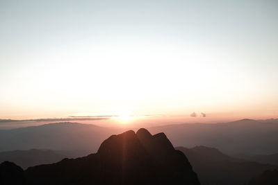 Scenic view of mountains against sky during sunset