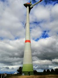 Low angle view of tower against cloudy sky