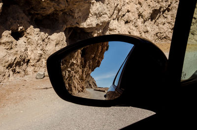 Reflection of car on side-view mirror