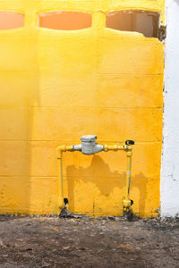 Old yellow wall by building