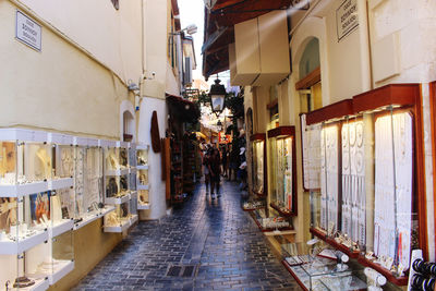 Narrow street amidst buildings in city