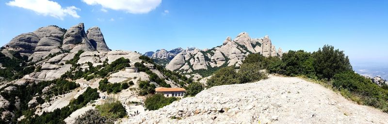 Panoramic view of rocky mountains against sky