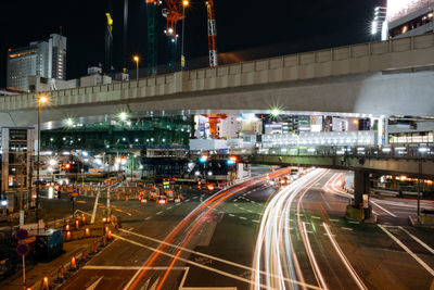 Light trails on road in city at night