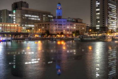 Reflection of illuminated buildings in water at night