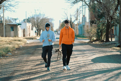 Friends togehther walking in the street