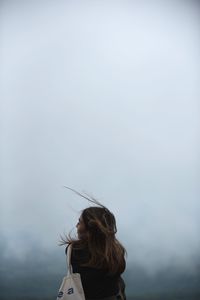 Rear view of woman looking at sky