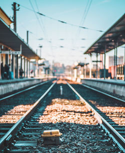 Close-up of railroad tracks against clear sky