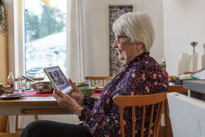 Senior woman using digital tablet