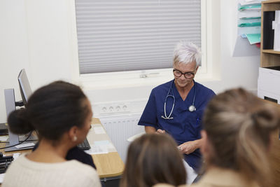 Family visiting doctor in health center