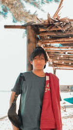 Portrait of young man standing outdoors