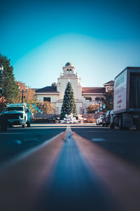 Street lines lead to a large christmas tree in old town
