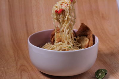 Close-up of rice in bowl on table