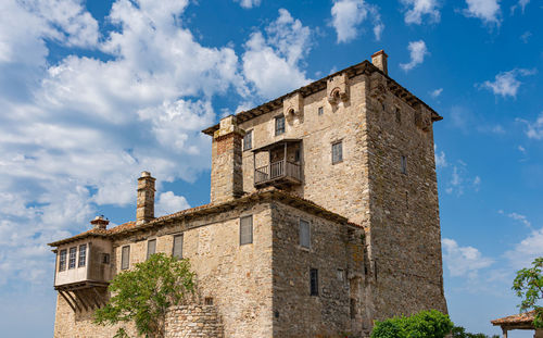 Low angle view of old building against sky