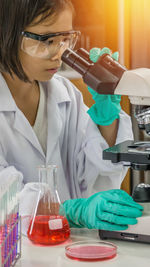 Portrait of scientist examining chemical in laboratory