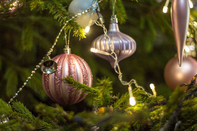 Close-up of christmas decorations hanging on tree