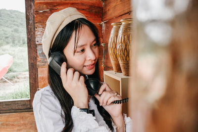 Portrait of young woman looking at camera
