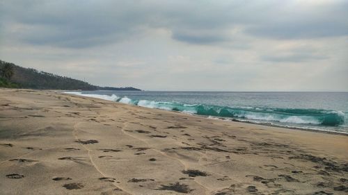 Scenic view of beach against sky