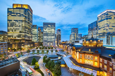 High angle view of illuminated buildings in city against sky