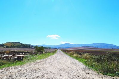 Country road leading towards mountains