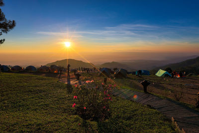 Scenic view of field against sky during sunset