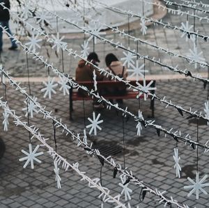 People walking on fence