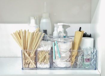 Bathroom shelf with beauty care accessories, cotton swabs, disks. . face skin care and hygiene.