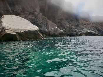 Scenic view of sea against mountain