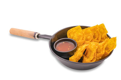 High angle view of food in bowl against white background