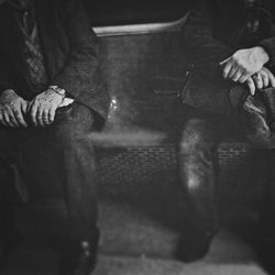 Low section of woman standing on tiled floor