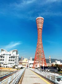 Low angle view of tower against blue sky