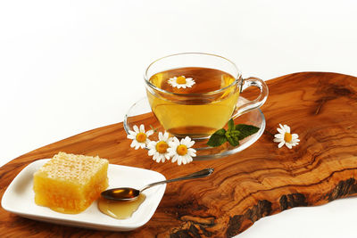 Close-up of drink on table against white background