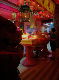 Illuminated carousel in amusement park