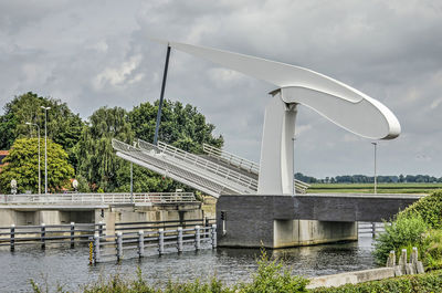 Sculptural drawbridge opening to let a boat pass