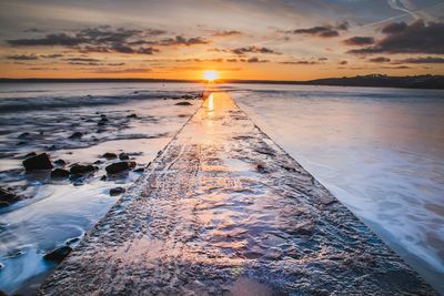 Scenic view of sea against sky during sunset